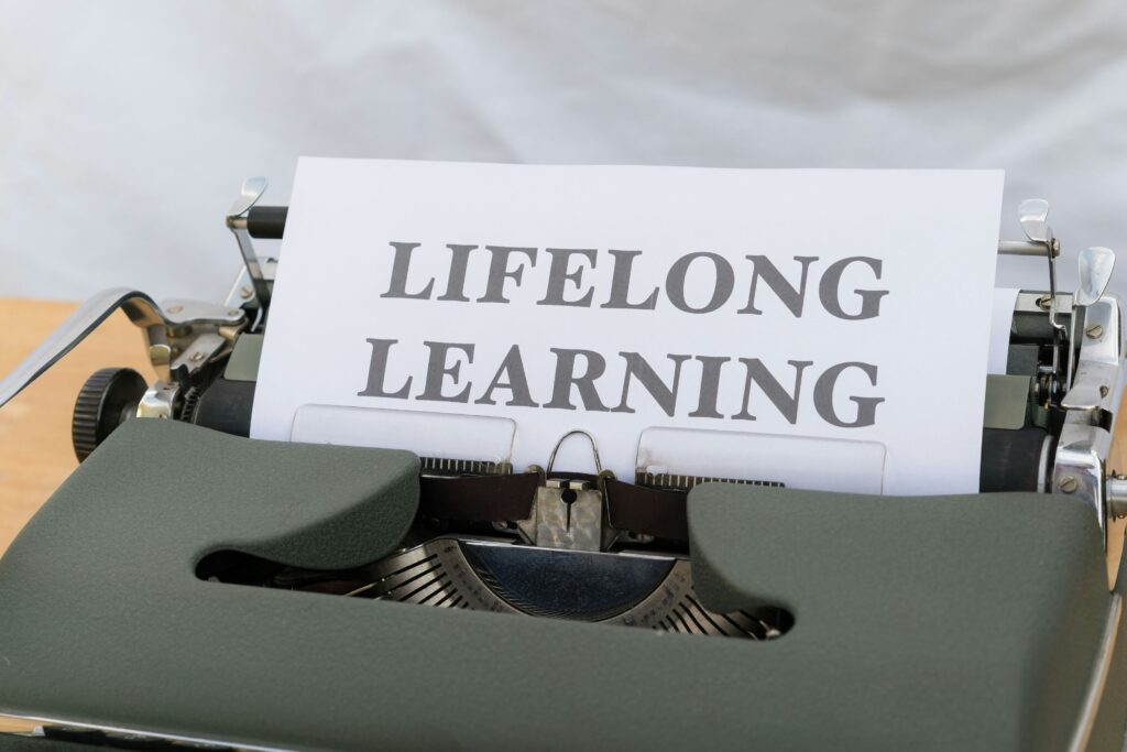 A typewriter with a page that says "lifelong learning"