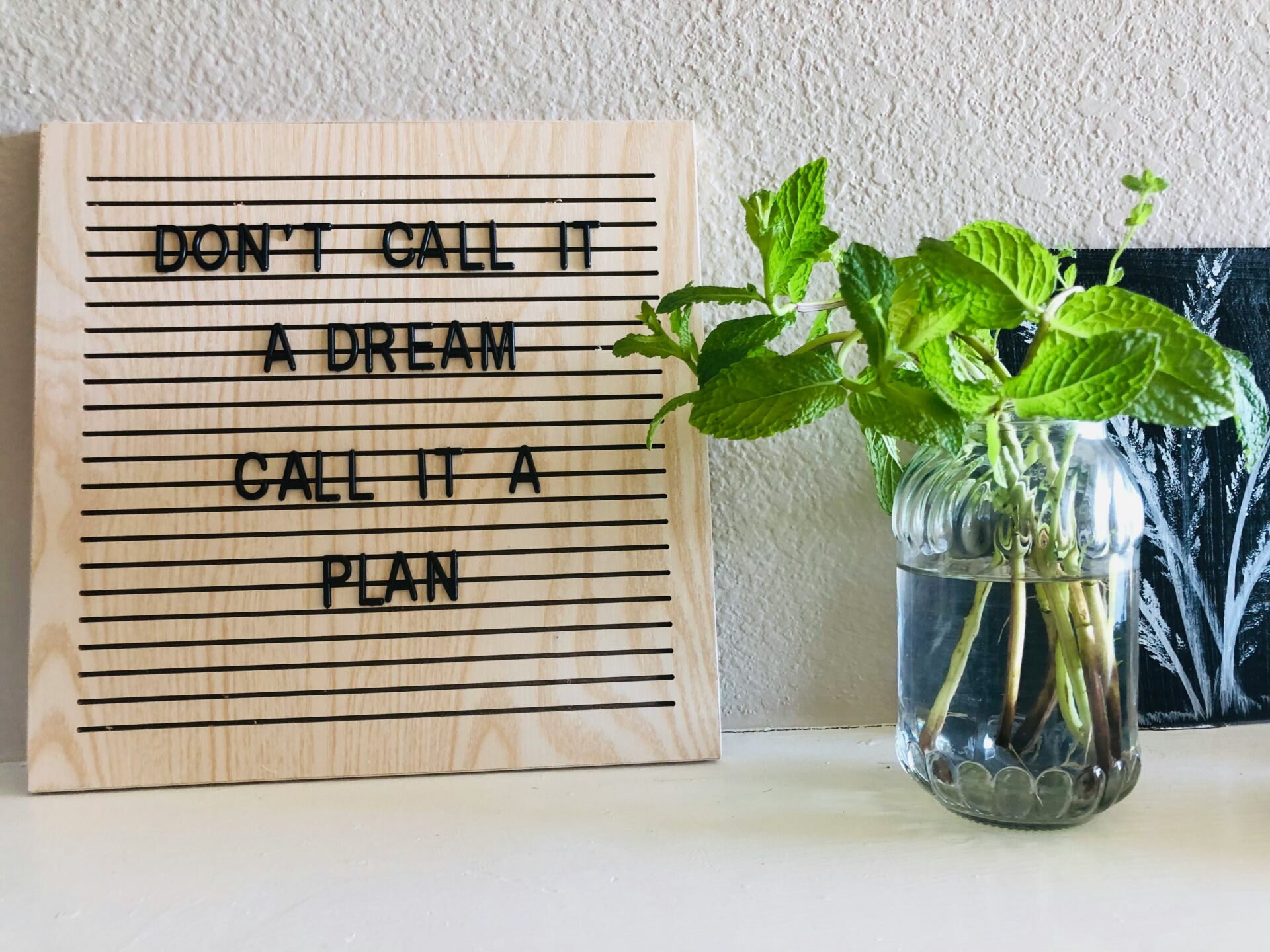 A sketch board with the words, "Don't call it a dream, call it a plan."