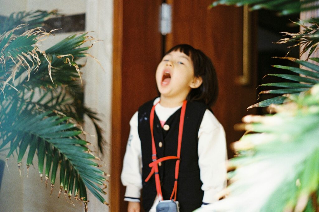 An elementary-aged kid shouts in frustration.